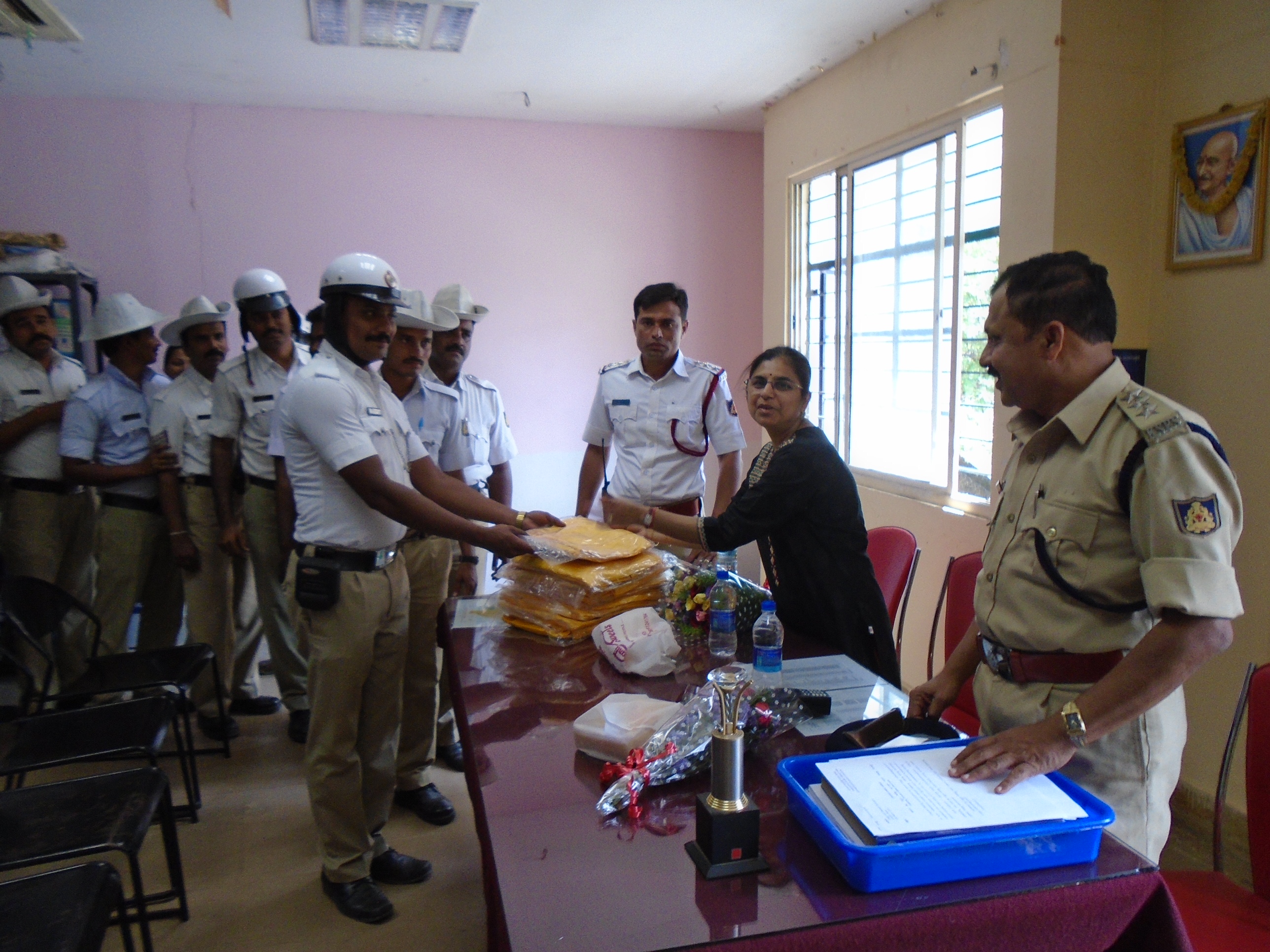 Distributing Raincoats at Ashoknagar Police Station, Bangalore